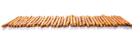 Brown, delicious pretzel sticks over white background