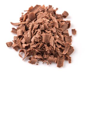 Dark brown chocolate pieces over white backgroundの写真素材