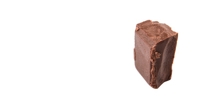 Dark brown chocolate pieces over white backgroundの写真素材