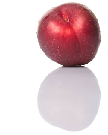 Victoria plum or red plum over white backgroundの写真素材
