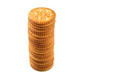 Round salted cracker over white backgroundの写真素材