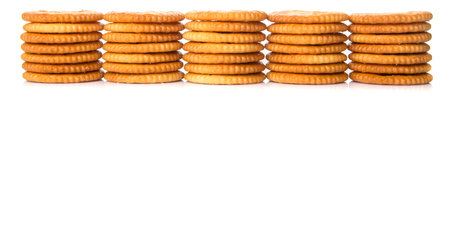 Round salted cracker over white background