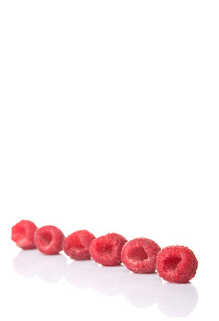 Raspberry fruit over white background