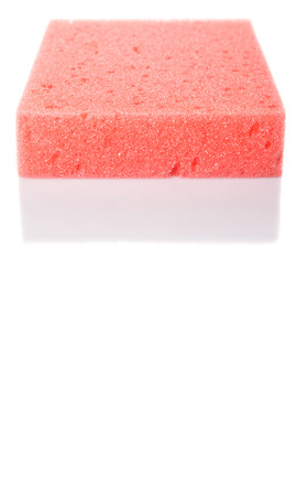Red dish washing sponge over white backgroundの写真素材