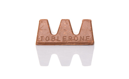 KUALA LUMPUR, MALAYSIA - APRIL 22ND, 2015. Created by Theodor Tobler in 1908,  Toblerone is a Swiss triangular chocolate bar brand owned by American Mondelez International.のeditorial素材