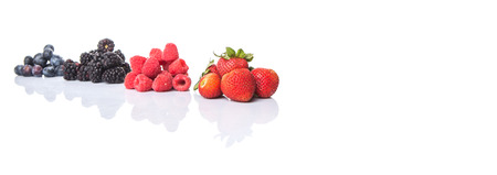 Strawberry, blackberry, blueberry and raspberry over white backgroundの写真素材
