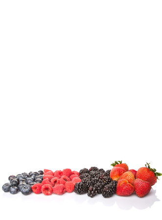 Strawberry, blackberry, blueberry and raspberry over white backgroundの写真素材