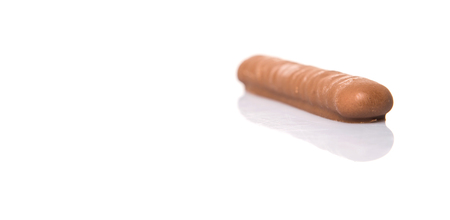 Chocolate coated finger biscuit over white backgroundの写真素材