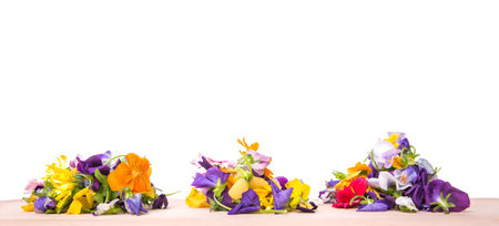 Mix edible flower salad over white backgroundの写真素材