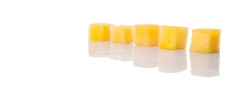 Bite size yellow watermelon over white backgroundの写真素材