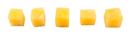 Bite size yellow watermelon over white background