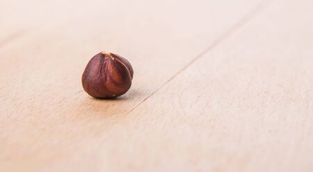 Hazelnut on wooden cutting boardの写真素材
