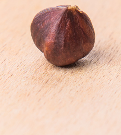 Hazelnut on wooden cutting boardの写真素材