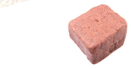 A block of traditionally made shrimp paste over white backgroundの写真素材