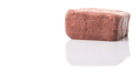 A block of traditionally made shrimp paste over white background