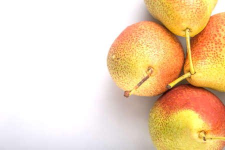 South African forelle pear fruit over white backgroundの写真素材