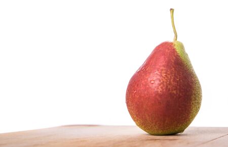 South African forelle pear fruit on wooden surfaceの写真素材
