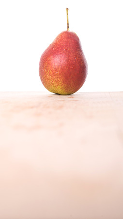 South African forelle pear fruit on wooden surfaceの写真素材