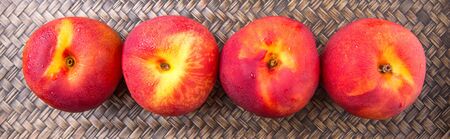 Nectarine fruit over wicker backgroundの写真素材