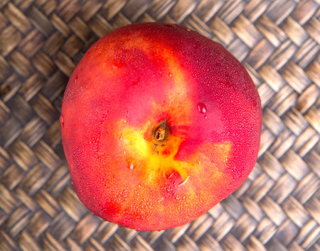 Nectarine fruit over wicker background