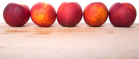 Nectarine fruit on wooden surfaceの写真素材