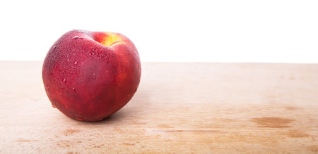 Nectarine fruit on wooden surfaceの写真素材