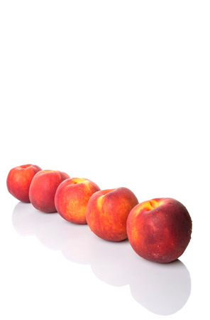 Nectarine fruits over white backgroundの写真素材