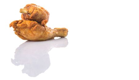 Deep fried chicken drumsticks over white backgroundの写真素材