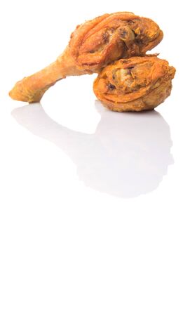 Deep fried chicken drumsticks over white backgroundの写真素材