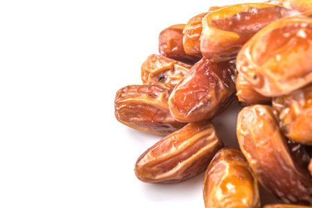 Date fruits over white background
