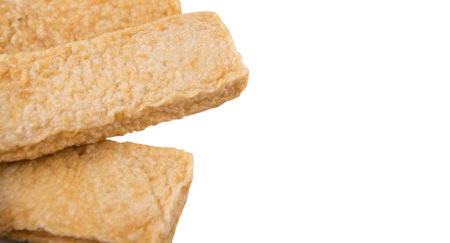 Raw fish fingers or fish stick over white backgroundの写真素材