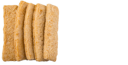 Raw fish fingers or fish stick over white background