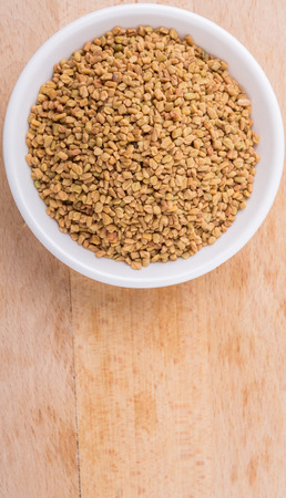 Fenugreek seed in white bowlの写真素材
