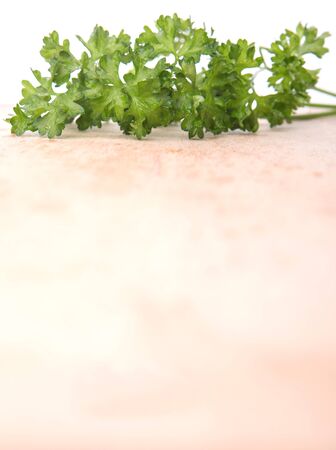 Parsley herbs leaves on wooden surfaceの写真素材