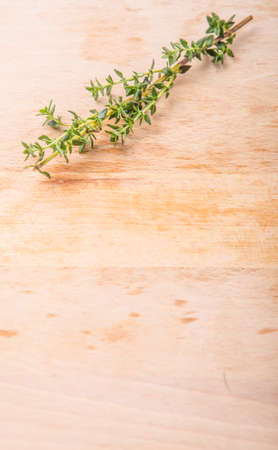 Thyme herbs leaves over wooden surfaceの写真素材