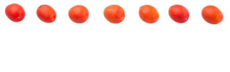 Bite sized red cherry grape tomato over white backgroundの写真素材