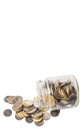 Malaysian coins in a mason jar over white backgroundの写真素材