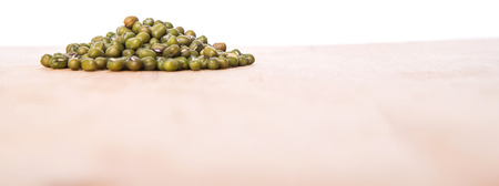 Mung beans on wooden boardの写真素材