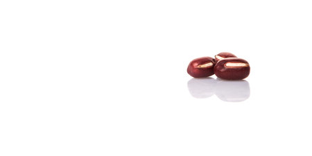 Red adzuki beans over white background