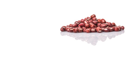 Red adzuki beans over white backgroundの写真素材