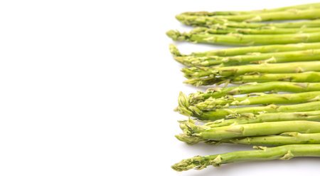 Fresh green asparagus vegetable over white backgroundの写真素材