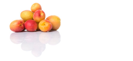 Ripe apricot over white backgroundの写真素材