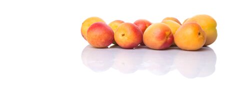 Ripe apricot over white backgroundの写真素材