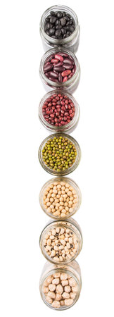 Black eye peas chickpeas adzuki beans mung bean soy beans black beans and red kidney beans in mason jars over white backgroundの写真素材