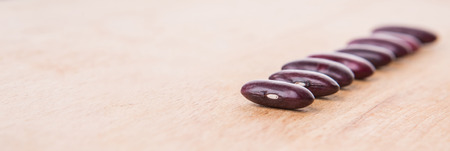 Red kidney beans on wooden backgroundの写真素材