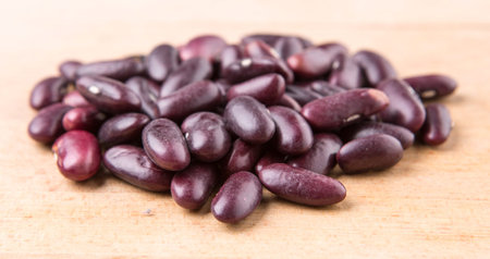 Red kidney beans on wooden background