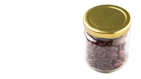 Red kidney beans in mason jar over white backgroundの写真素材