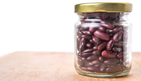 Red kidney beans in mason jar over wooden backgroundの写真素材