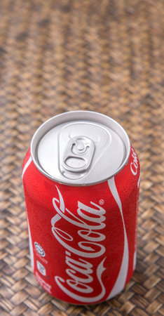 PUTRAJAYA MALAYSIA  JUNE 28TH 2015. Coca Cola can on wicker background. Coca Cola drinks are...