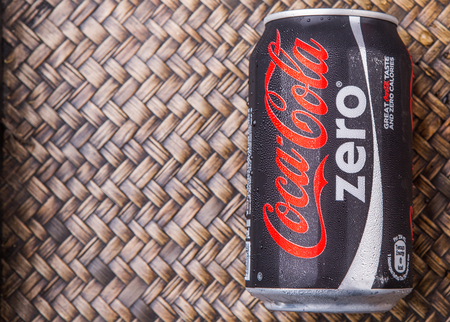PUTRAJAYA MALAYSIA  JUNE 28TH 2015. Coca Cola Zero on wicker background. Coca Cola drinks are produced and manufactured by The CocaCola Company an American multinational beverage corporation.のeditorial素材